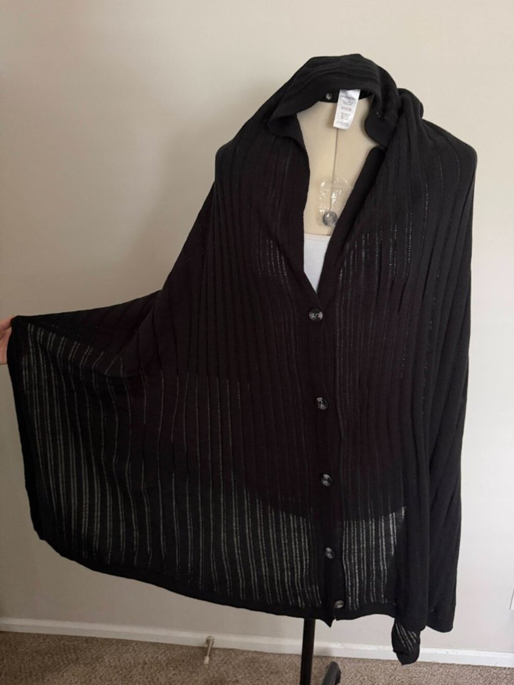 Ribbed knit poncho with large buttons, one size.
